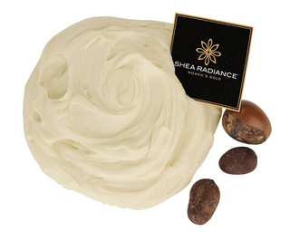 Shea Butter Scoop with a Shea Radiance card on it, next to three shea nuts