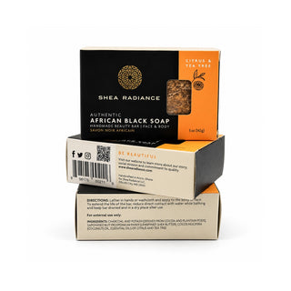 Three stacked boxes of Shea Radiance Authentic citrus African Black Soap on a clean white background. The top box is black and orange, showing the citrus and tea tree scent.