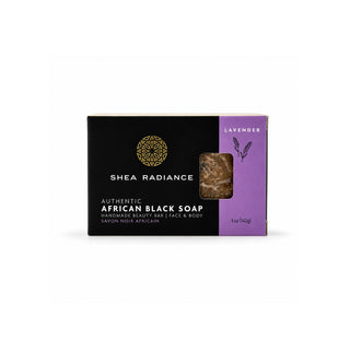A single bar of Shea Radiance Authentic African Black Soap in the lavender scent, presented in its black and purple packaging with a small clear window showing the dark brown soap bar inside.