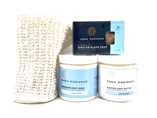 Shea Radiance unscented body care moisture regimen including a soap bar, nourishing cream, whipped butter, and sisal cloth on a white background
