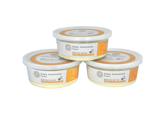 Three containers of Shea Radiance Orange & Clove Raw Shea Butter on a white background.