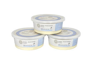 Three containers of Shea Radiance unscented raw shea butter on a white surface.