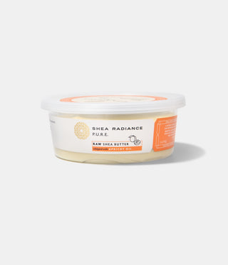 Container of Shea Radiance apricot raw shea butter on a white background