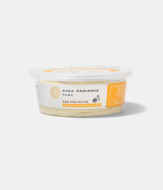 Container of Shea Radiance Orange & Clove Raw Shea Butter on a white background