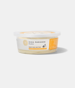 Small Container of Shea Radiance orange & clove raw shea butter on a white background