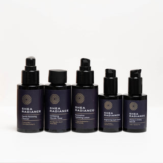 Shea Radiance travel size brightening face care regimen with cleanser, exfoliating toner, hydrating lotion, brightening serum, and vitamin C oil on a white background