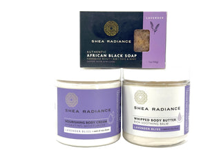 Shea Radiance lavender body care moisture regimen including a soap bar, nourishing cream, and whipped butter on a white background