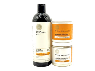 Shea Radiance citrus skincare products including body wash, nourishing cream, and whipped butter on a white background