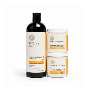 Shea Radiance citrus skincare products including body wash, nourishing cream, and whipped butter on a white background