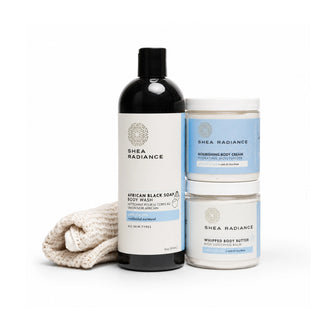 Shea Radiance unscented skincare products including a body wash, nourishing cream, whipped butter and sisal cloth on a white background