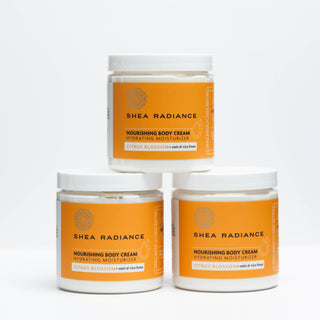 Three jars of Shea Radiance citrus nourishing body cream on a white background