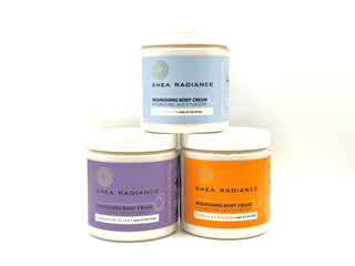 Three jars of mixed scents of Shea Radiance body cream on a white background
