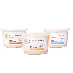 Three large containers of a variety of Shea Radiance raw shea butter scents on a white background