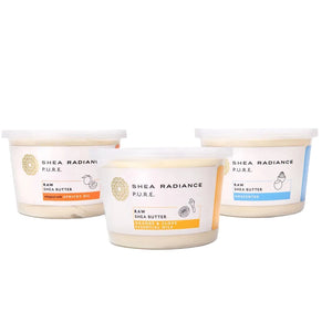 Three large containers of a variety of Shea Radiance raw shea butter scents on a white background