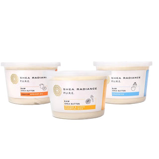 Three large containers of a variety of Shea Radiance raw shea butter scents on a white background