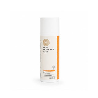 A pump bottle of Shea Radiance Brightening Body Lotion, with branding and product information displayed.