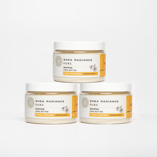 Three jars of Shea Radiance citrus Pure Whipped Shea Butter on a white background
